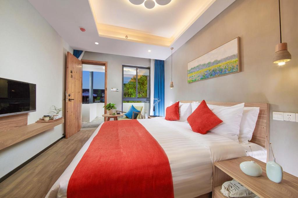 Postel nebo postele na pokoji v ubytování WuZhen Dream Hotel