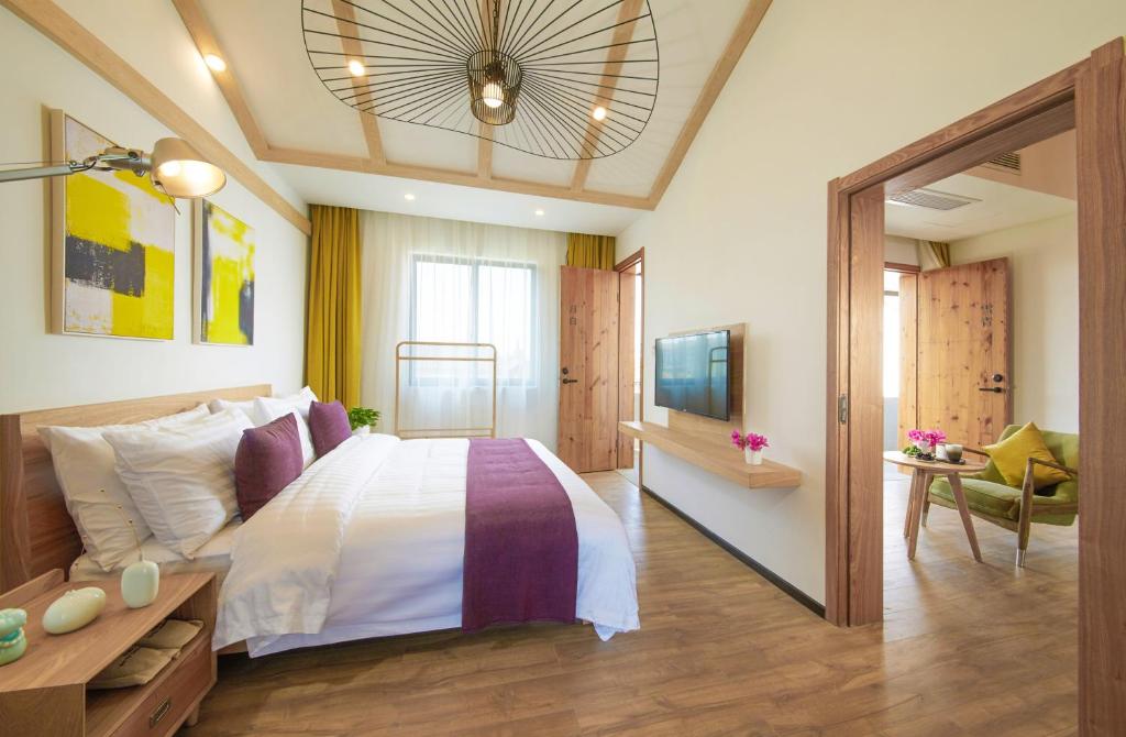 Postel nebo postele na pokoji v ubytování WuZhen Dream Hotel