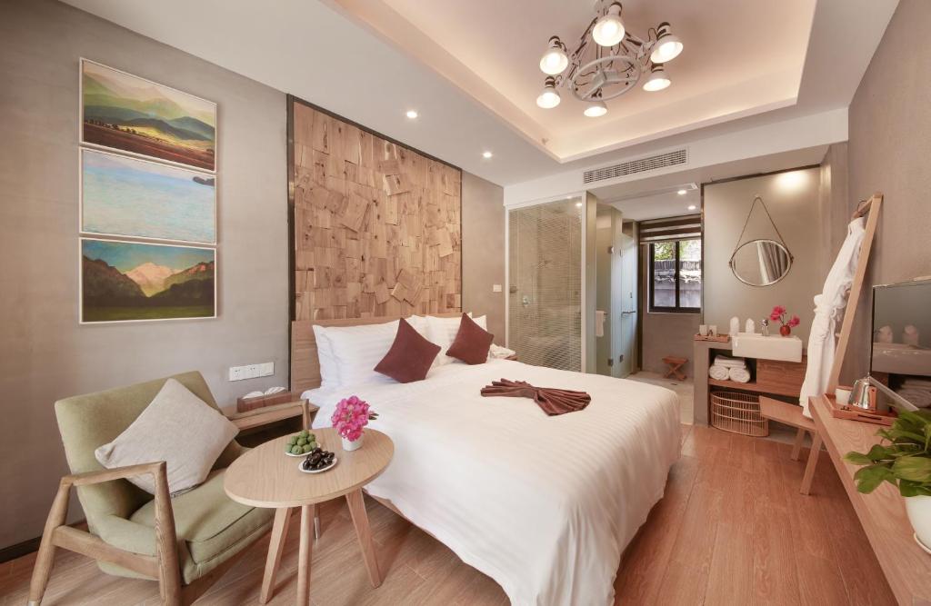 Postel nebo postele na pokoji v ubytování WuZhen Dream Hotel