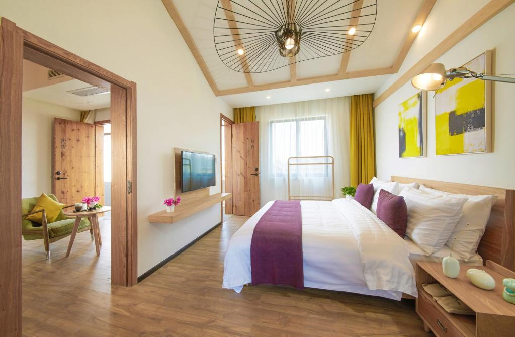 Postel nebo postele na pokoji v ubytování WuZhen Dream Hotel