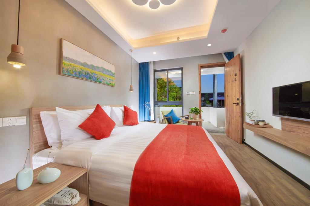Postel nebo postele na pokoji v ubytování WuZhen Dream Hotel