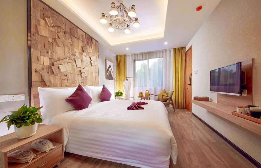Postel nebo postele na pokoji v ubytování WuZhen Dream Hotel