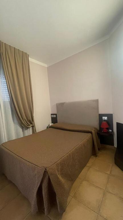 Postel nebo postele na pokoji v ubytování Hotel San Marco