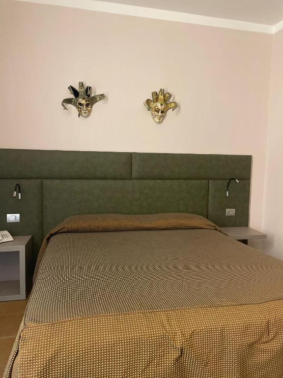 Postel nebo postele na pokoji v ubytování Hotel San Marco