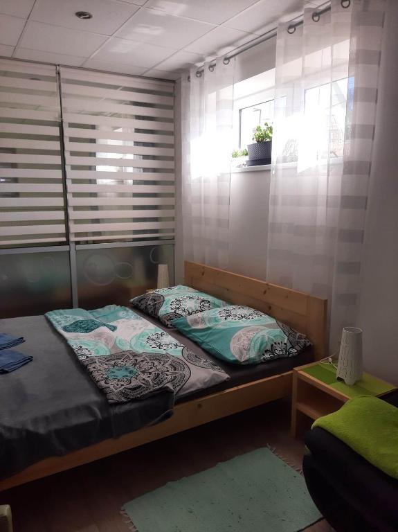 Postel nebo postele na pokoji v ubytování Apartmany Kras