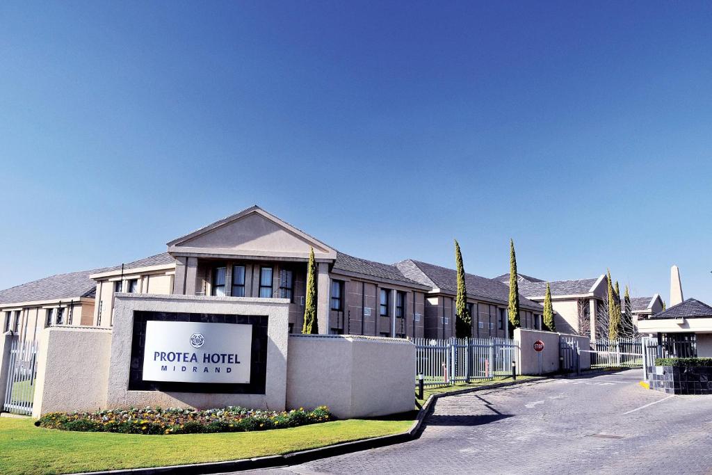 a building with a sign that reads more hotel at Protea Hotel by Marriott Midrand in Midrand