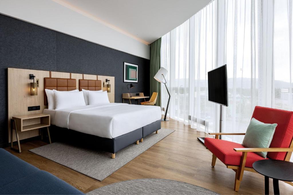 Voodi või voodid majutusasutuse Four Points by Sheraton Panoramahaus Dornbirn toas