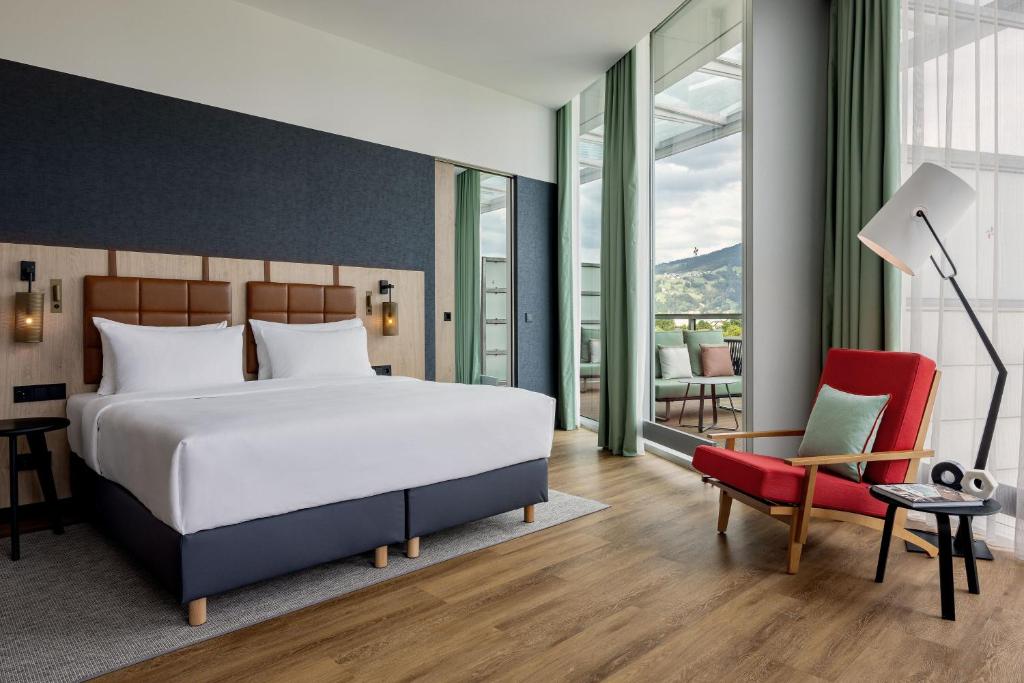 Voodi või voodid majutusasutuse Four Points by Sheraton Panoramahaus Dornbirn toas