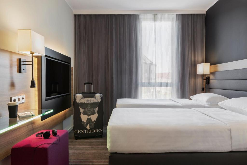 Postel nebo postele na pokoji v ubytování Moxy Copenhagen Sydhavnen