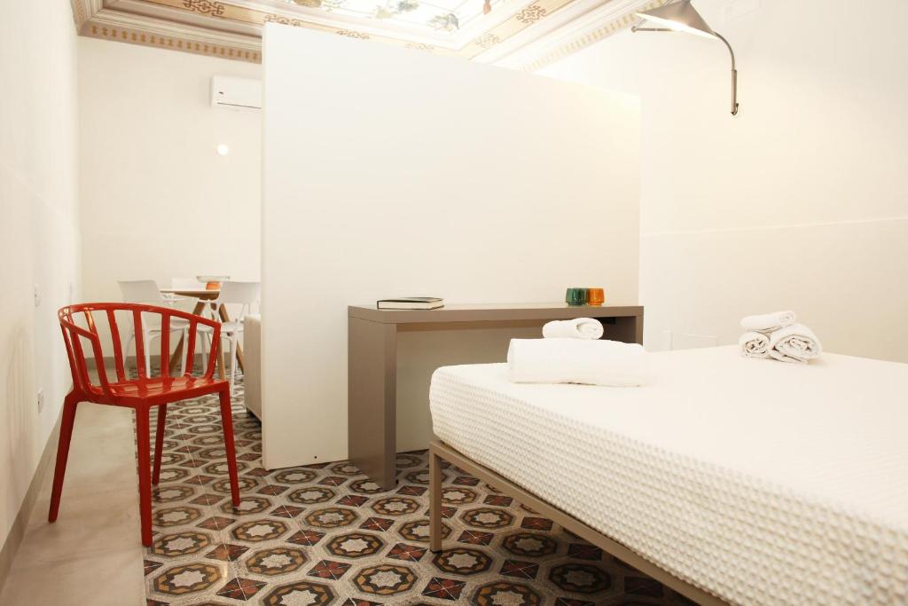 Postel nebo postele na pokoji v ubytování VersoMare room & suite