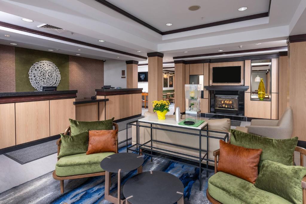 a living room with couches and a fireplace at Fairfield Inn and Suites by Marriott New Bedford in New Bedford