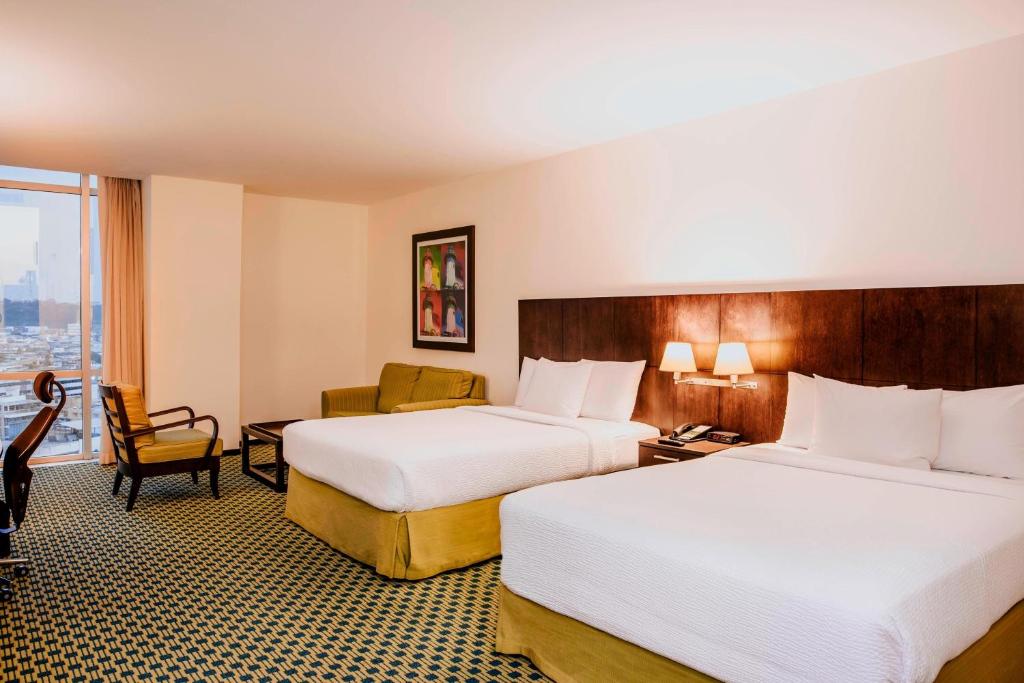 Postel nebo postele na pokoji v ubytování Courtyard by Marriott Guayaquil