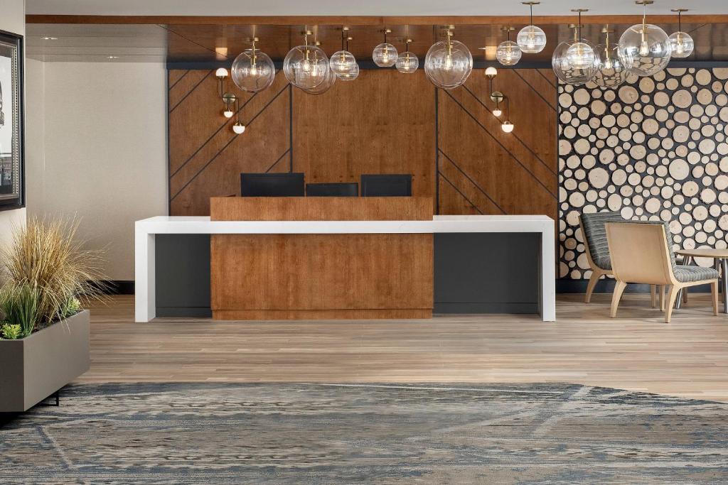 an office lobby with a reception desk and chairs at Residence Inn Denver South/Park Meadows Mall in Centennial