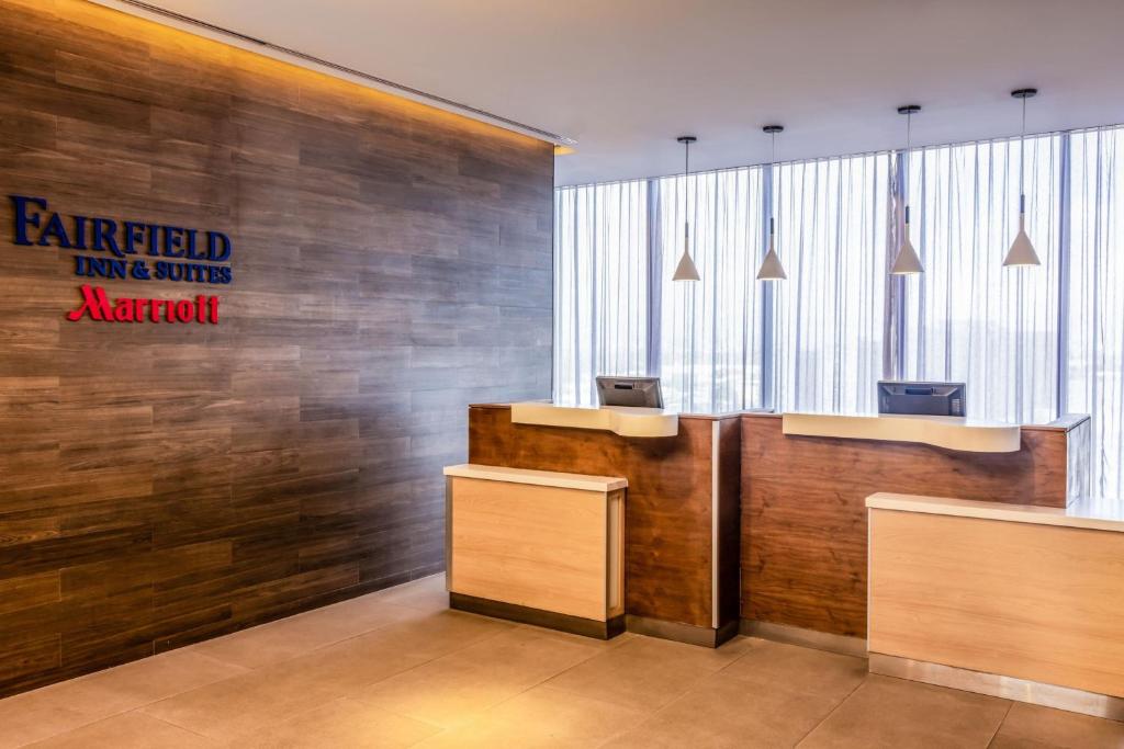 a lobby of an office with a sign on the wall at Fairfield Inn & Suites by Marriott Mexico City Vallejo in Mexico City
