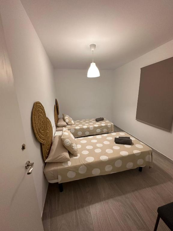 A bed or beds in a room at La casa de la Abuela