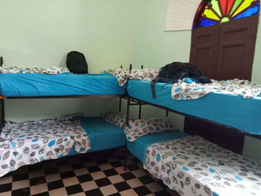 Postel nebo postele na pokoji v ubytování Auberge De Jeunesse