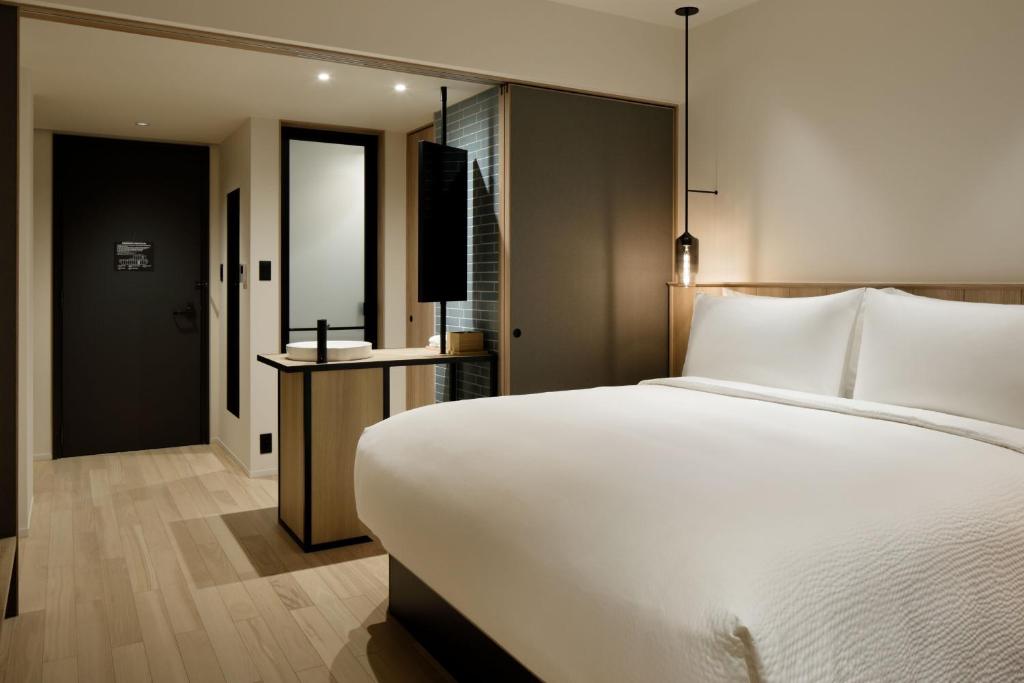 Postel nebo postele na pokoji v ubytování Fairfield by Marriott Nara Tenri Yamanobenomichi