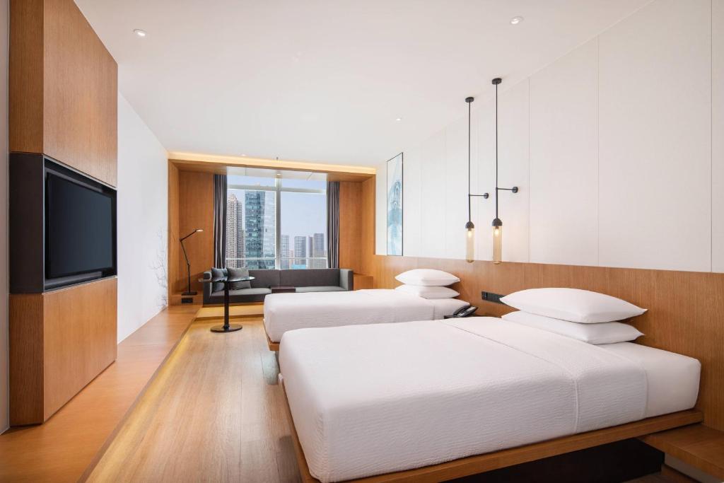 Postel nebo postele na pokoji v ubytování Fairfield by Marriott Foshan Nanhai