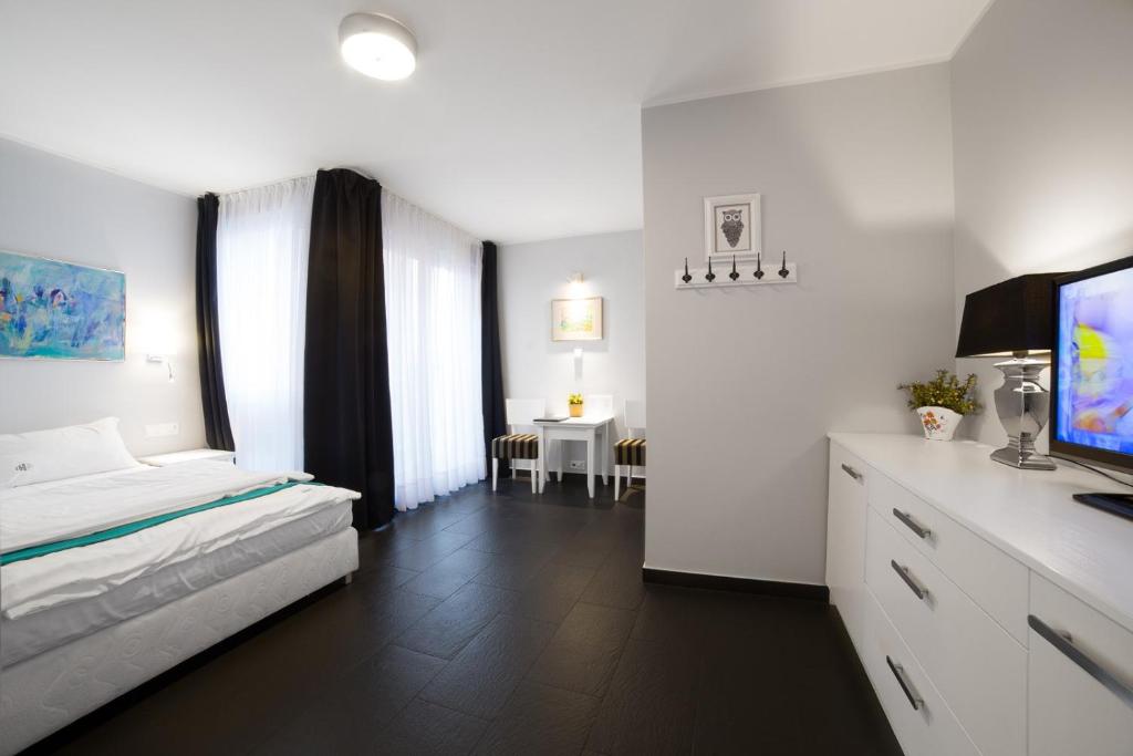 Postel nebo postele na pokoji v ubytování HOTEL Amber Suite & SPA - Enklawa dla Dorosłych