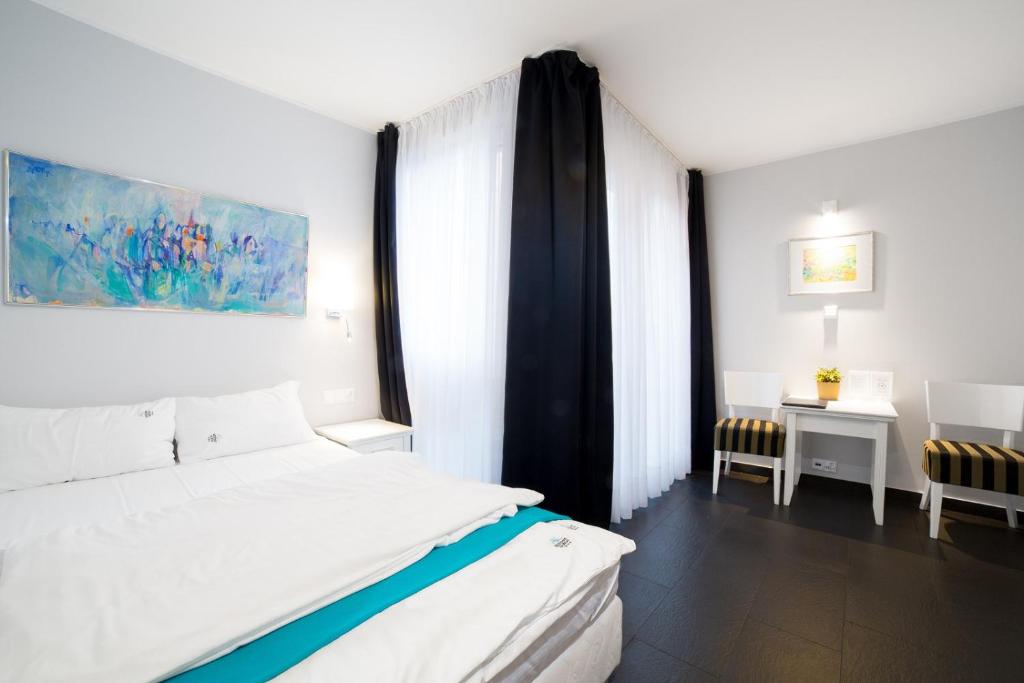Postel nebo postele na pokoji v ubytování HOTEL Amber Suite & SPA - Enklawa dla Dorosłych
