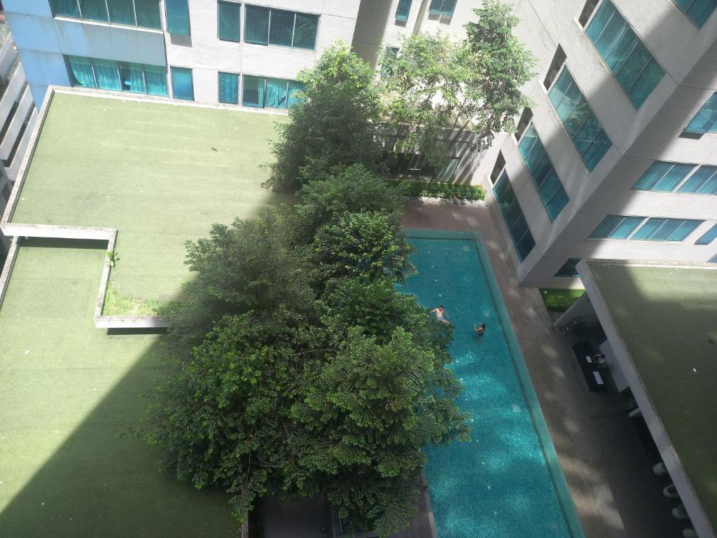 an overhead view of a swimming pool in a building at CUSHY DORM at KLCC in Kuala Lumpur