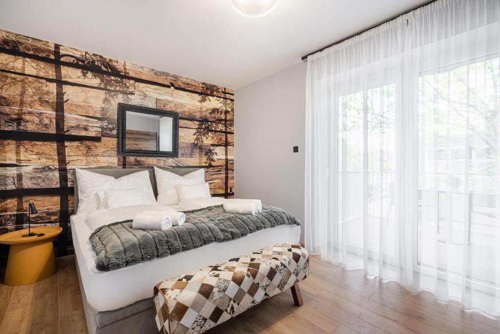 Postel nebo postele na pokoji v ubytování Radnoti Home