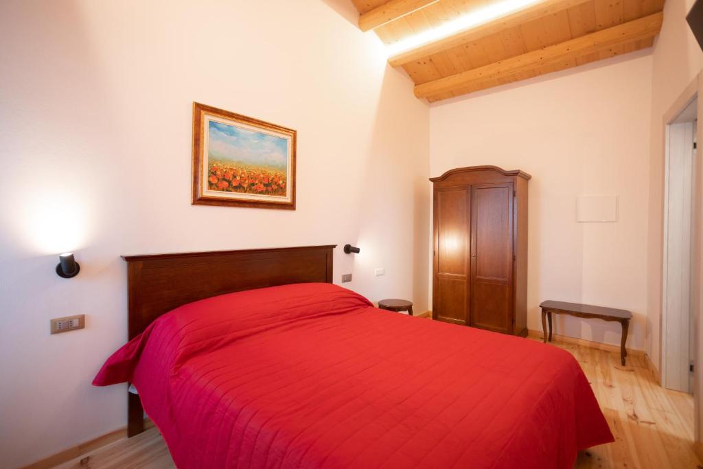 Postel nebo postele na pokoji v ubytování B&B Basta Bussare