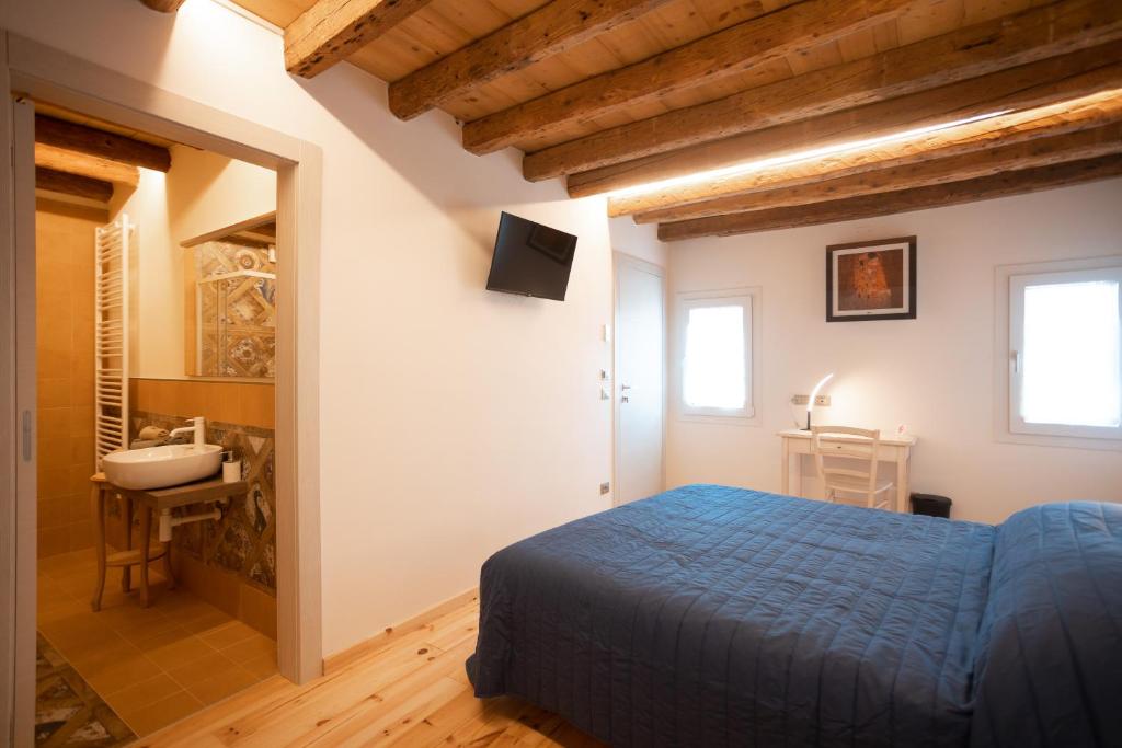 Postel nebo postele na pokoji v ubytování B&B Basta Bussare