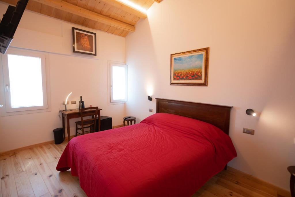 Postel nebo postele na pokoji v ubytování B&B Basta Bussare