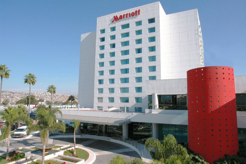 a hotel with a red column in front of a building at Marriott Tijuana Hotel in Tijuana