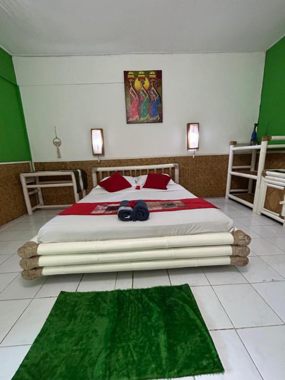 Postel nebo postele na pokoji v ubytování Rumah Kundun