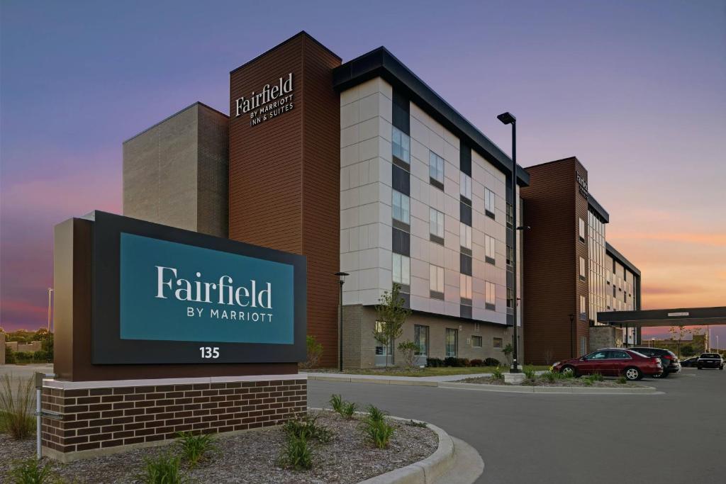 a rendering of a hotel with a sign in a parking lot at Fairfield Inn & Suites by Marriott Milwaukee Brookfield in Brookfield
