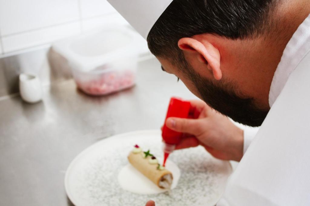a man eating a piece of food on a plate at Principe Alogna Hotel & SPA in Altavilla Milicia