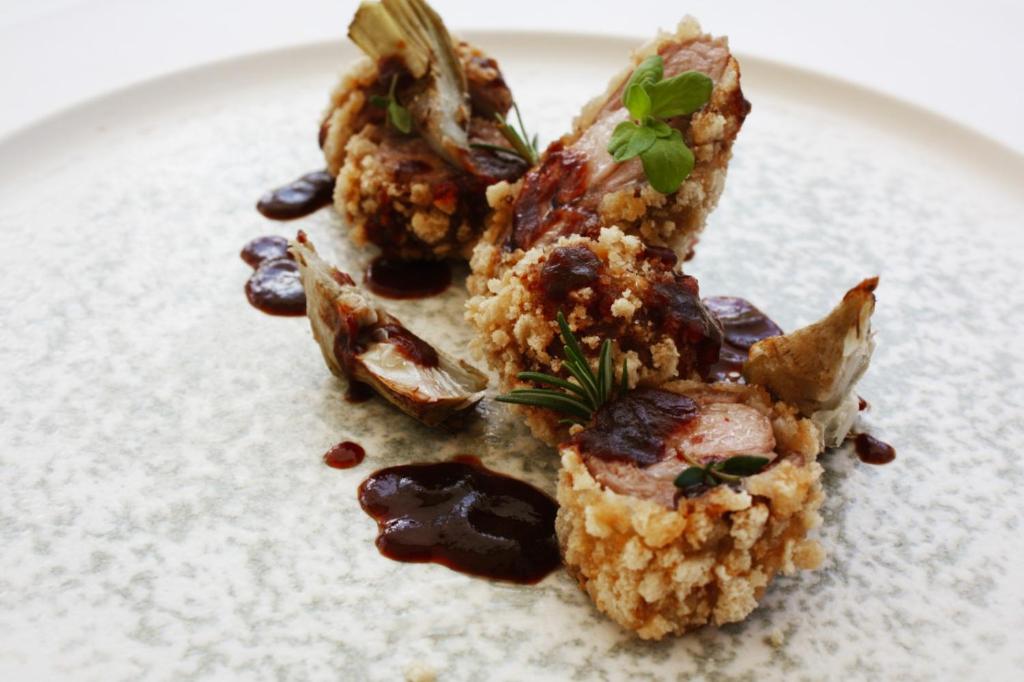 a plate of food with some food on it at Principe Alogna Hotel & SPA in Altavilla Milicia