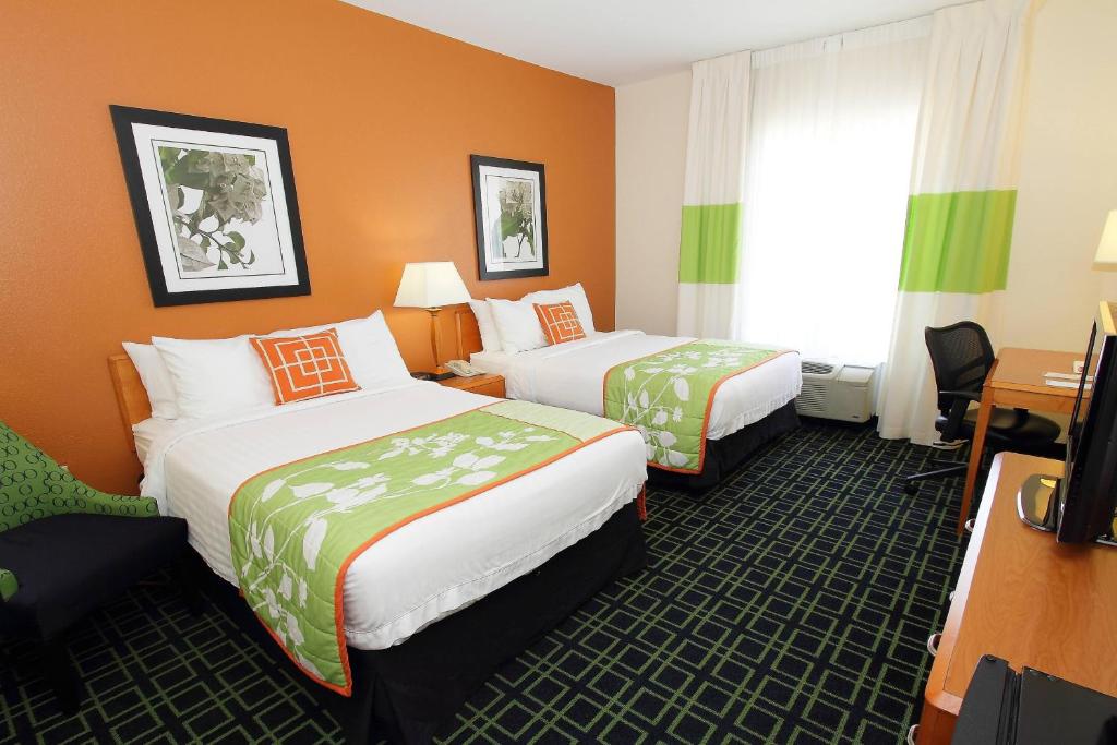 a hotel room with two beds and a desk at Fairfield Inn & Suites by Marriott Killeen in Killeen
