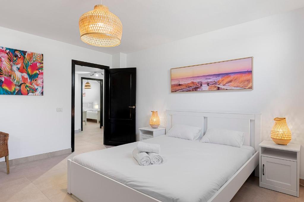 Posteľ alebo postele v izbe v ubytovaní MEDANO4YOU The Palm Tree Holiday Home