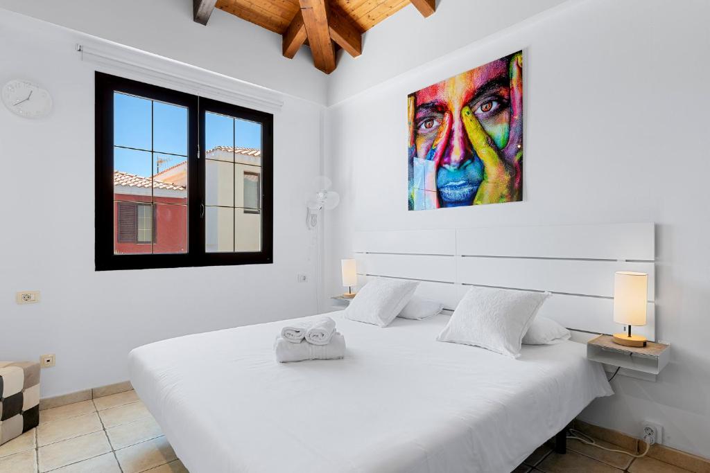 Posteľ alebo postele v izbe v ubytovaní MEDANO4YOU The Palm Tree Holiday Home