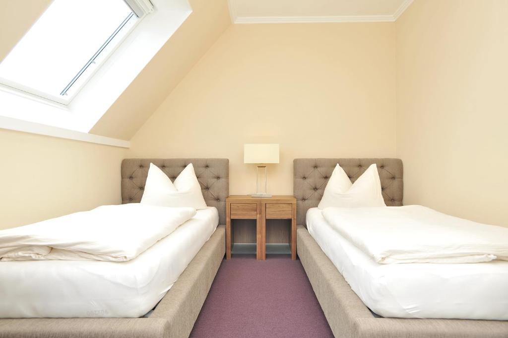 Postel nebo postele na pokoji v ubytování Aparthotel Friesenhof
