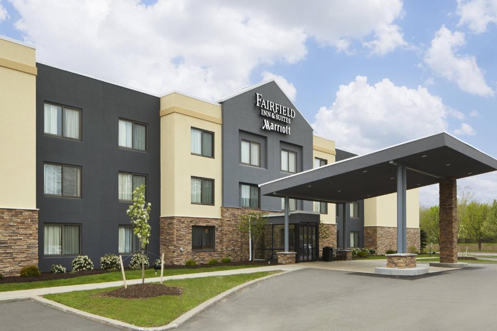a rendering of the front of a hotel with a building at Fairfield Inn by Marriott Rochester East in Webster