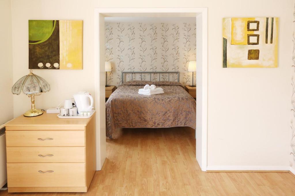 Letto o letti in una camera di Dorset Hotel, Isle of Wight