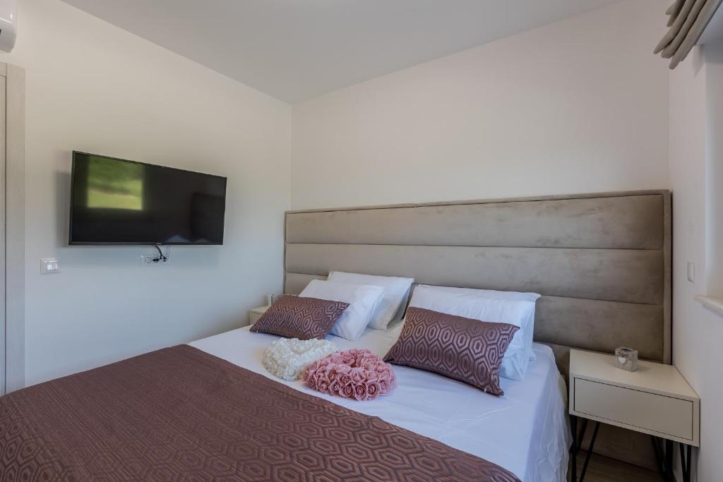 Postel nebo postele na pokoji v ubytování Luxury Apartments Katarina