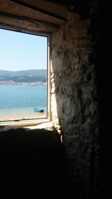 Fotografie z fotogalerie ubytování La Moira - casa de piedra frente al mar v destinaci Esteiro