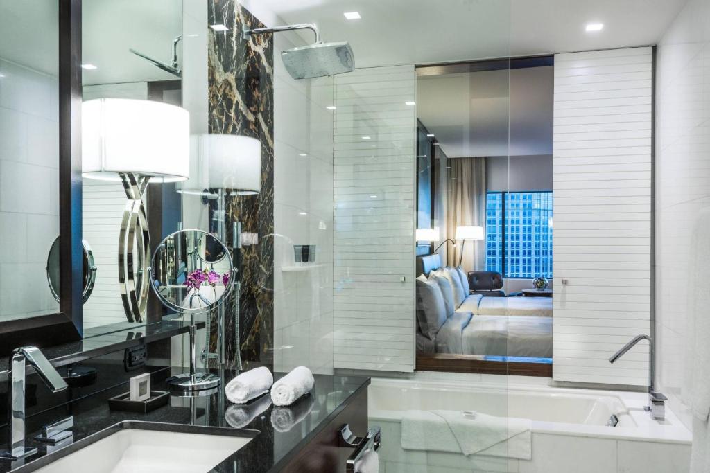 a bathroom with a tub and a sink and a shower at JW Marriott Hotel Santo Domingo in Santo Domingo