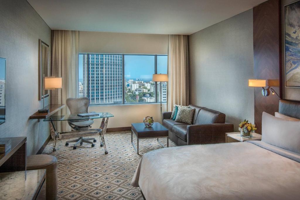 a hotel room with a bed and a desk at JW Marriott Hotel Santo Domingo in Santo Domingo