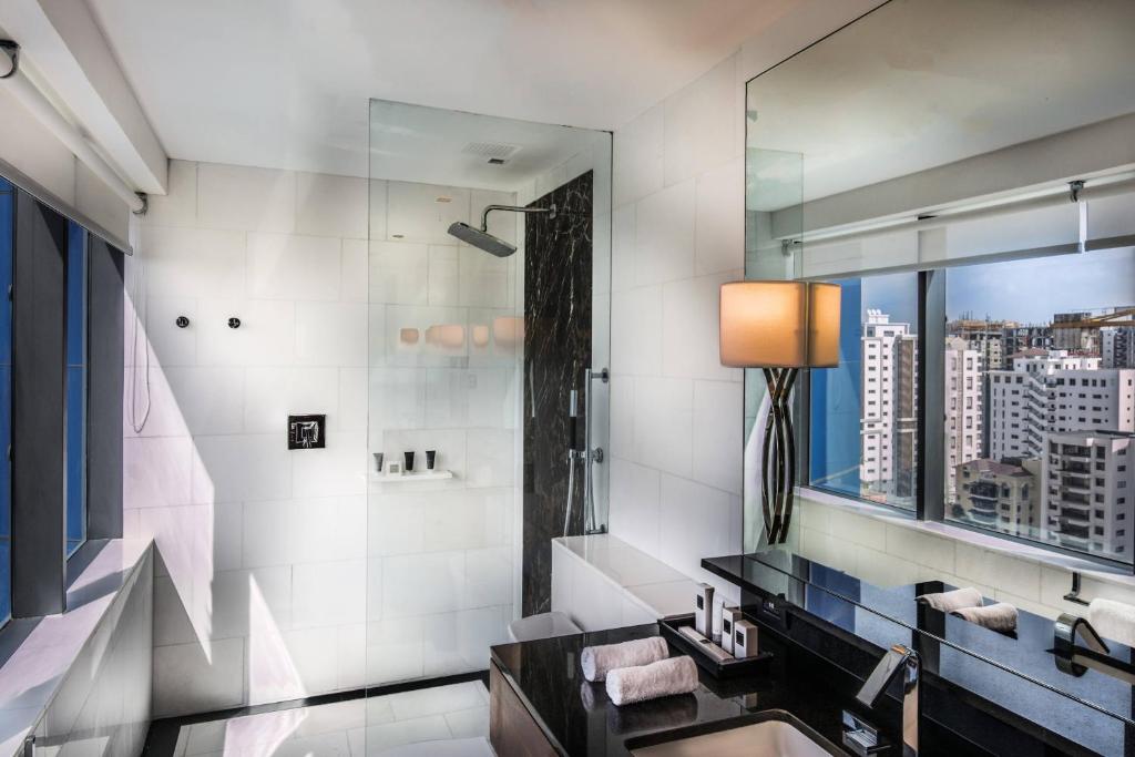 a bathroom with a sink and a mirror at JW Marriott Hotel Santo Domingo in Santo Domingo