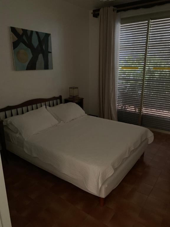 Posteľ alebo postele v izbe v ubytovaní Casa Rossa Solenzara