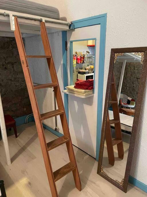 a room with a bunk bed and a mirror at Chez dada in Grenoble