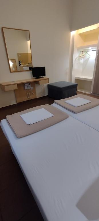Postel nebo postele na pokoji v ubytování Sweetmar guest Rooms-ground floor