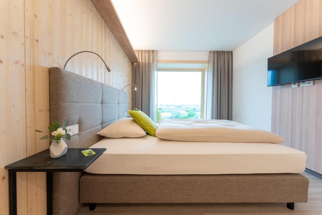 Postel nebo postele na pokoji v ubytování eee Hotel Eberstalzell