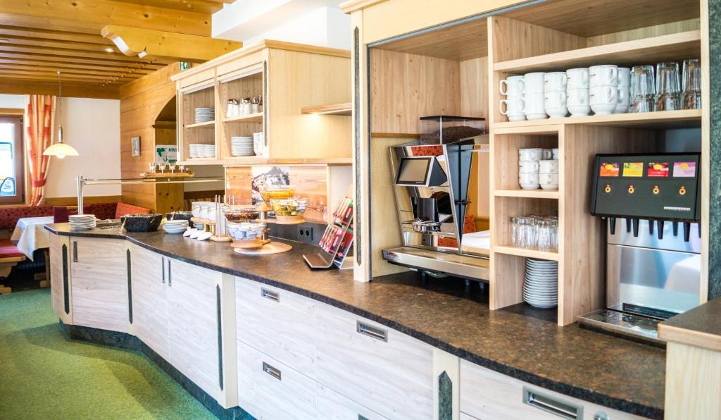 Kuchyň nebo kuchyňský kout v ubytování Apart-Hotel Forellenhof